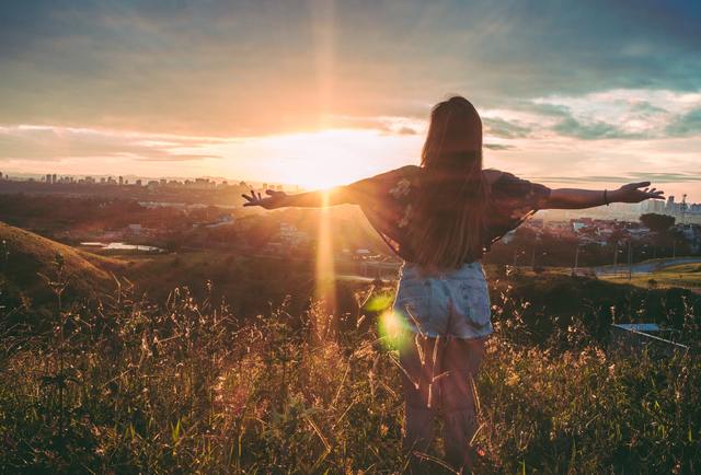 girl standing in a sunset
